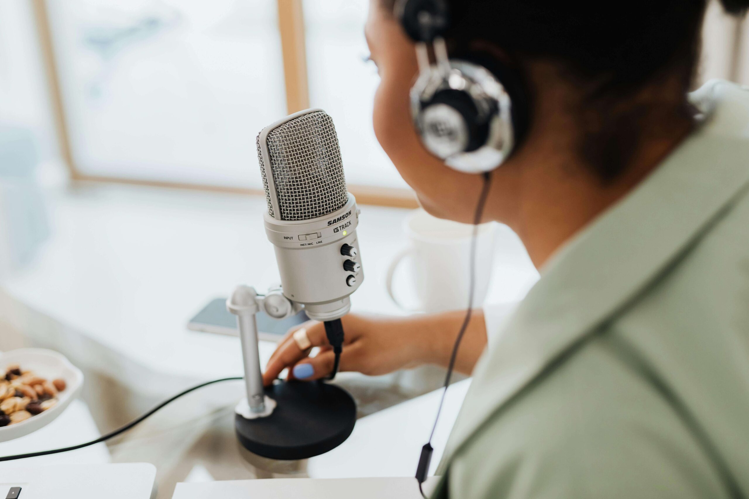 Woman with Mic on Podcast